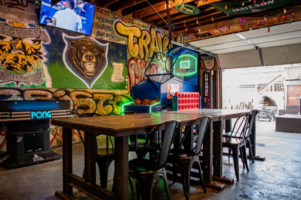 Party table under the bear mural and neon