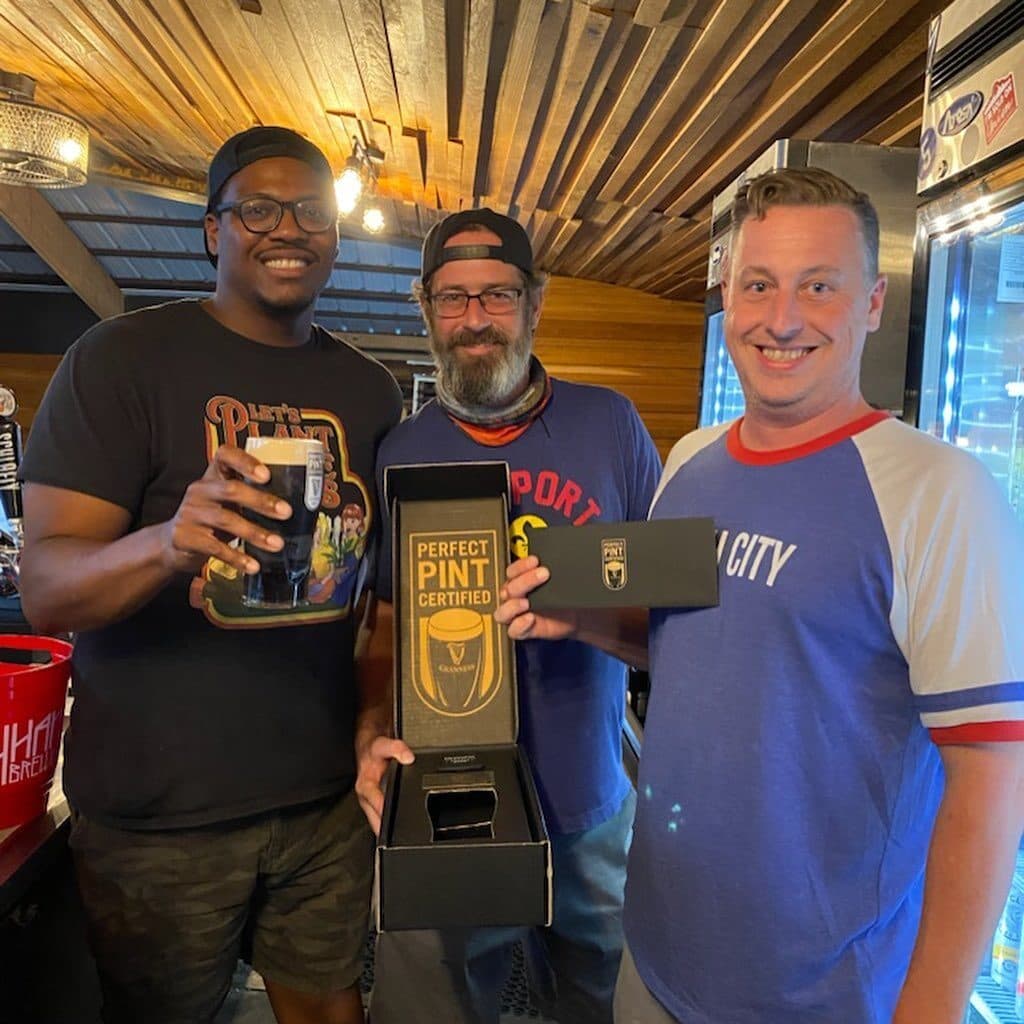 Perfect Pint certified — three regulars make it official