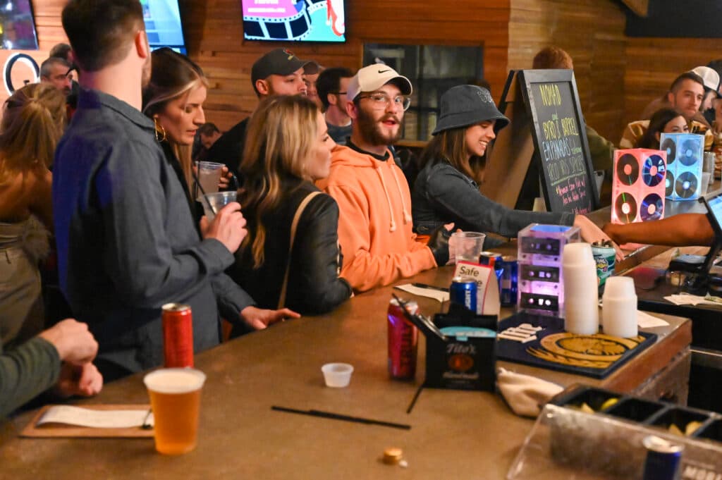 Packed bar, chalkboard menu, good night