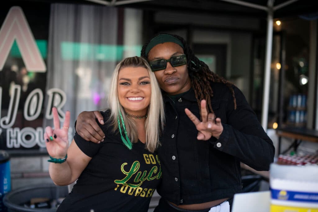 Peace signs and a Go Lucky Yourself shirt