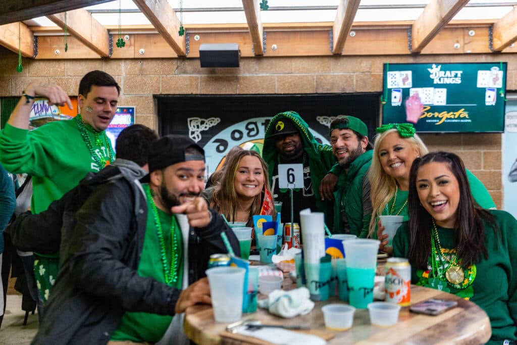 Full table on parade day, Dogtown mural behind