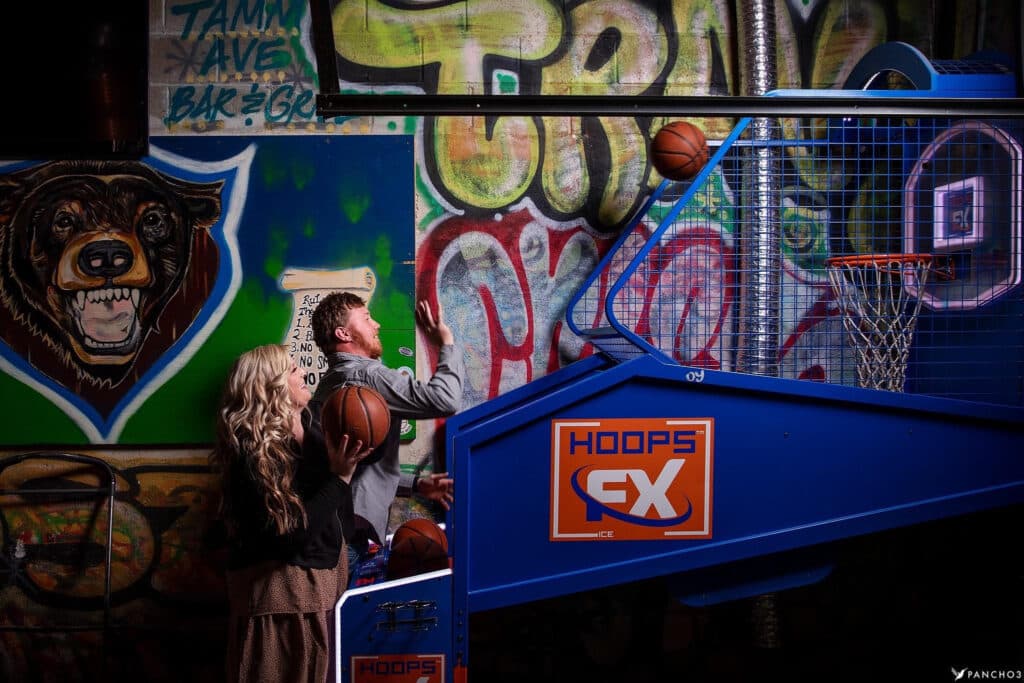 Engagement shoot at the pop-a-shot, Tamm Ave graffiti behind